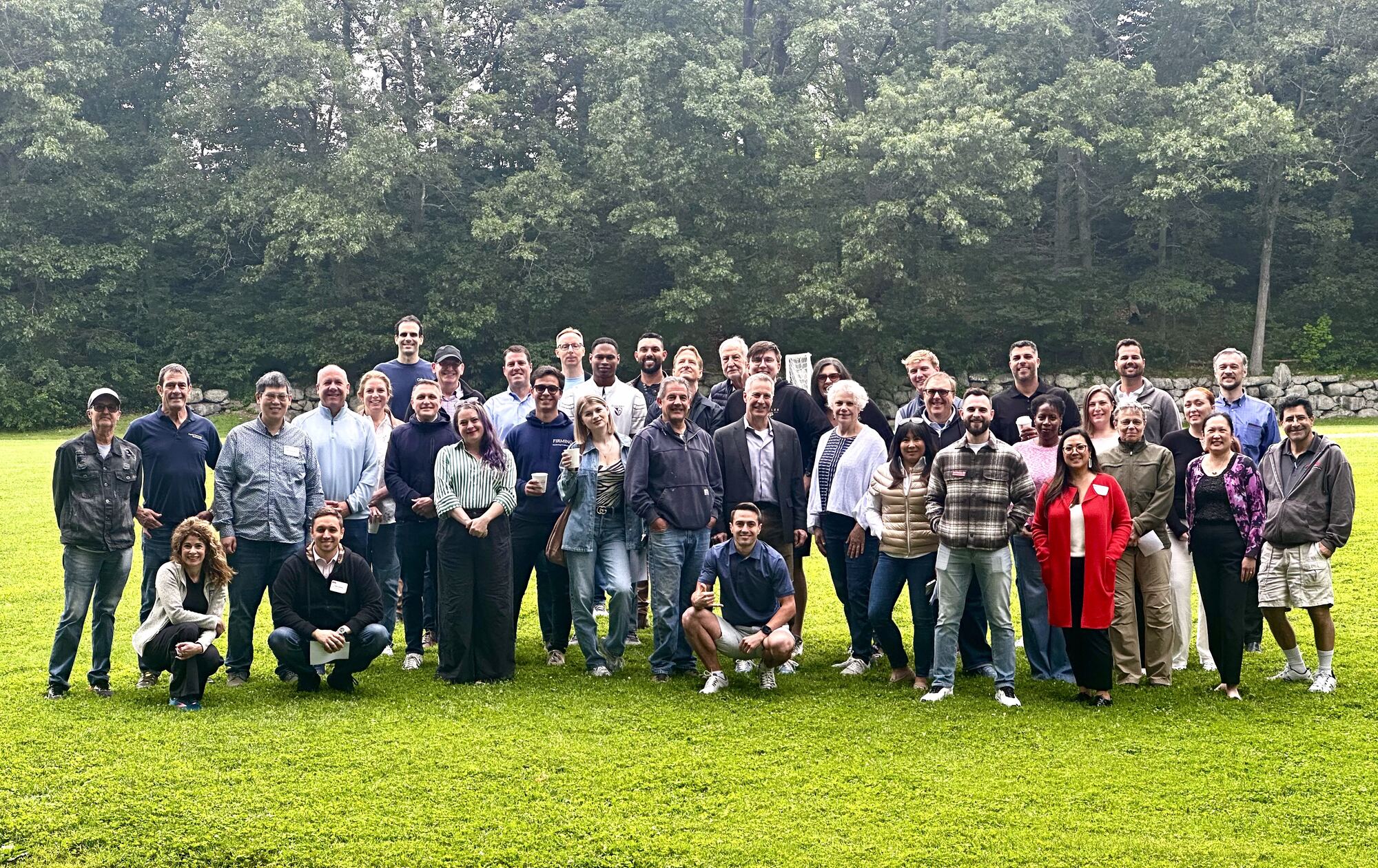 BNI Brookline Networkers members gathered for a group photo on a lawn